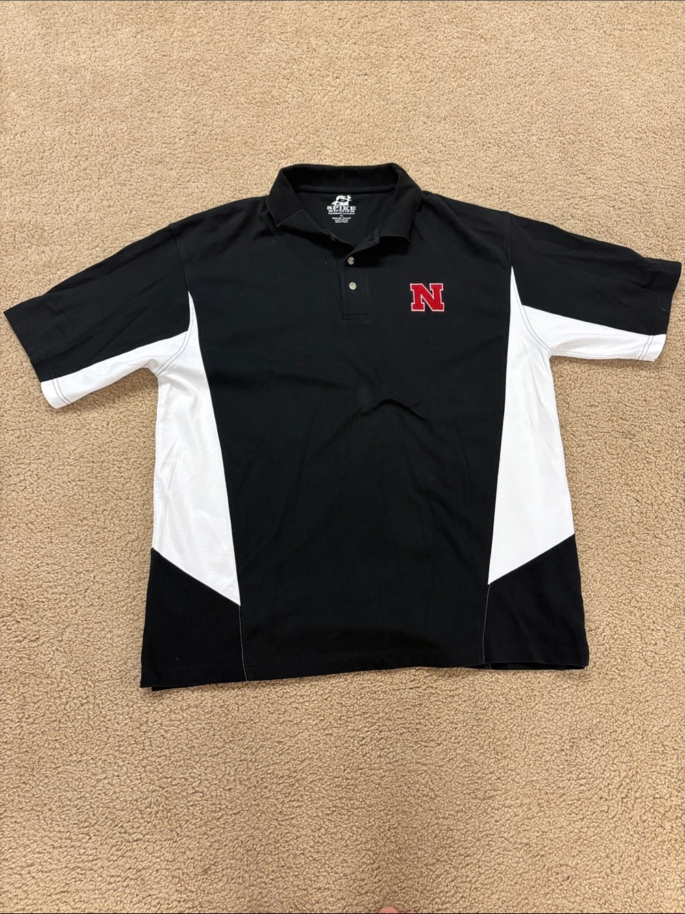 Husker Black Short-Sleeve Polo with White Panels and Red 'N' Patch
